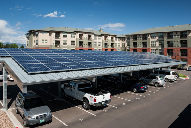 Wazee Partners installed an 84.24 KwH solar panel system atop sloped carports at the Wheat Ridge Town Center Apartments.
